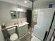 Efficient bathroom design with stacked washer/dryer and modern fixtures at 1888 Peeler Rd, Dunwoody, GA 30338