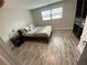 Comfortable bedroom featuring built-in closet, stylish decor, and ample natural light at 1888 Peeler Rd, Dunwoody, GA 30338