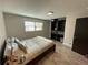 Well-lit bedroom features a built-in closet system, and window at 1888 Peeler Rd, Dunwoody, GA 30338