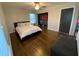 Bedroom with hardwood floors, closet with an organization system, and a queen size bed at 1888 Peeler Rd, Dunwoody, GA 30338