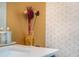 Stylish bathroom detail featuring designer tile and fixtures on the vanity backsplash at 5915 Brookgreen Rd, Atlanta, GA 30328