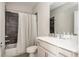 Cozy bathroom featuring modern fixtures, a tiled shower with a shower curtain, and a modern vanity at 5915 Brookgreen Rd, Atlanta, GA 30328
