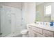 Bright bathroom with a glass-enclosed shower, double vanity, and stylish tile at 5915 Brookgreen Rd, Atlanta, GA 30328