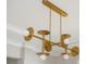 Modern gold chandelier with unique design, adding elegance to any room at 5915 Brookgreen Rd, Atlanta, GA 30328