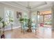 Bright dining room with stylish chairs, and a round glass table and access to a covered porch at 5915 Brookgreen Rd, Atlanta, GA 30328