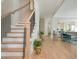 Open-concept foyer leading to living spaces, showcasing hardwood floors and natural light, creating an inviting atmosphere at 5915 Brookgreen Rd, Atlanta, GA 30328
