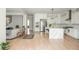 Bright, open kitchen with white cabinetry, stainless steel appliances, and a large island at 5915 Brookgreen Rd, Atlanta, GA 30328