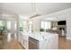 Open concept kitchen with large island, stainless steel appliances, and views of the living room at 5915 Brookgreen Rd, Atlanta, GA 30328