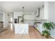 Modern kitchen with white cabinets, stainless appliances, and stylish marble countertops at 5915 Brookgreen Rd, Atlanta, GA 30328
