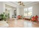 Spacious living area featuring hardwood floors, large windows, and stylish decor creating a welcoming atmosphere at 5915 Brookgreen Rd, Atlanta, GA 30328