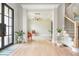 Bright living room with beautiful hardwood floors, elegant lighting, and an open floor plan for easy entertaining at 5915 Brookgreen Rd, Atlanta, GA 30328