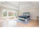 Spacious main bedroom with tray ceiling, large windows offering an abundance of natural light and a seating area at 5915 Brookgreen Rd, Atlanta, GA 30328