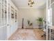 Charming home office with custom built-in shelving, hardwood floors, and natural light streaming through the windows at 5915 Brookgreen Rd, Atlanta, GA 30328