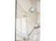 Modern shower with dual showerheads and elegant beige marble-look tiling at 5915 Brookgreen Rd, Atlanta, GA 30328