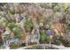 Aerial view showing a quiet neighborhood surrounded by lush trees and foliage at 1025 Pace Rd, Hiram, GA 30141