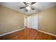 A cozy bedroom with hardwood floors, a ceiling fan, and a double-door closet at 1025 Pace Rd, Hiram, GA 30141