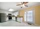 Well-lit kitchen equipped with stainless steel appliances and a ceiling fan at 1025 Pace Rd, Hiram, GA 30141
