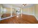 Spacious living room boasting shiny hardwood floors and an open layout leading to the kitchen at 1025 Pace Rd, Hiram, GA 30141
