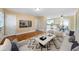 Cozy living room features hardwood floors, a modern ceiling fan, and ample natural light at 1025 Pace Rd, Hiram, GA 30141