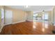 Bright living room showcasing shiny hardwood floors and a seamless flow into the kitchen at 1025 Pace Rd, Hiram, GA 30141