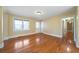 Inviting living room with gleaming hardwood floors, neutral paint, and a large window at 1025 Pace Rd, Hiram, GA 30141