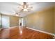 A bright and airy main bedroom featuring hardwood floors, and ceiling fans for comfort at 1025 Pace Rd, Hiram, GA 30141
