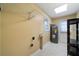 Utility room or mudroom with essential fixtures and neutral colored walls at 1025 Pace Rd, Hiram, GA 30141