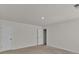 Bright, carpeted bedroom with two doors and light walls at 1054 Mackets Ct, Atlanta, GA 30354