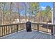 Wooden deck overlooking the backyard, perfect for relaxing or entertaining guests at 1054 Mackets Ct, Atlanta, GA 30354