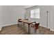 Dining room with hardwood floors, natural light, a table, and two chairs at 1054 Mackets Ct, Atlanta, GA 30354
