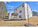 Two-story home featuring a wooden deck and siding, located in a suburban setting at 1054 Mackets Ct, Atlanta, GA 30354