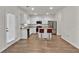 Bright kitchen with white cabinets, stainless steel appliances, and a breakfast bar with seating at 1054 Mackets Ct, Atlanta, GA 30354
