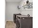 This laundry room features two grey machines and overhead storage at 1054 Mackets Ct, Atlanta, GA 30354