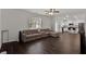 Bright, open-concept living room with hardwood floors connecting to the kitchen at 1054 Mackets Ct, Atlanta, GA 30354