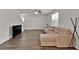 Open-concept living room featuring hardwood floors and a comfortable sectional sofa at 1054 Mackets Ct, Atlanta, GA 30354