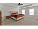 Spacious main bedroom with carpet, two windows, and neutral paint at 1054 Mackets Ct, Atlanta, GA 30354