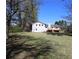 Home exterior features a large lawn and wood deck at 2110 E Cherokee Dr, Woodstock, GA 30188