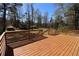 Beautiful backyard and wood deck features great outdoor entertaining space at 2110 E Cherokee Dr, Woodstock, GA 30188