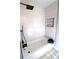 Modern bathroom with white subway tile, stylish fixtures, and a contrasting niche at 2110 E Cherokee Dr, Woodstock, GA 30188