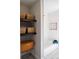 Bathroom with decorative shelves, patterned tile floors, and modern fixtures at 2110 E Cherokee Dr, Woodstock, GA 30188
