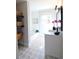 Bright bathroom featuring patterned tile floors, a modern vanity, and decorative shelves at 2110 E Cherokee Dr, Woodstock, GA 30188