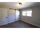 Bedroom with a barn door, hardwood flooring, and natural light at 2110 E Cherokee Dr, Woodstock, GA 30188