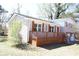 This charming home boasts a brick facade, a cozy porch, and an attached two-car garage at 2110 E Cherokee Dr, Woodstock, GA 30188