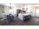 This modern kitchen features white cabinets, a large island with seating, and updated appliances at 2110 E Cherokee Dr, Woodstock, GA 30188