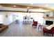 Open-concept living area with hardwood floors, exposed beams, and modern kitchen view at 2110 E Cherokee Dr, Woodstock, GA 30188
