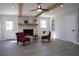 Bright living room with hardwood floors, brick fireplace, and stylish furniture at 2110 E Cherokee Dr, Woodstock, GA 30188