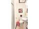 Bathroom featuring a pedestal sink and framed artwork at 4083 Rivermeade Sw Dr, Lilburn, GA 30047