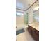 Cozy bathroom with tile flooring, a bathtub with shower, and a vanity at 4083 Rivermeade Sw Dr, Lilburn, GA 30047