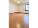 Spacious bedroom featuring hardwood floors and a large window for natural light at 4083 Rivermeade Sw Dr, Lilburn, GA 30047