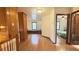 Hallway with hardwood floors leading to a bedroom at 4083 Rivermeade Sw Dr, Lilburn, GA 30047